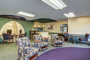 A common area with chairs at Three Meadows